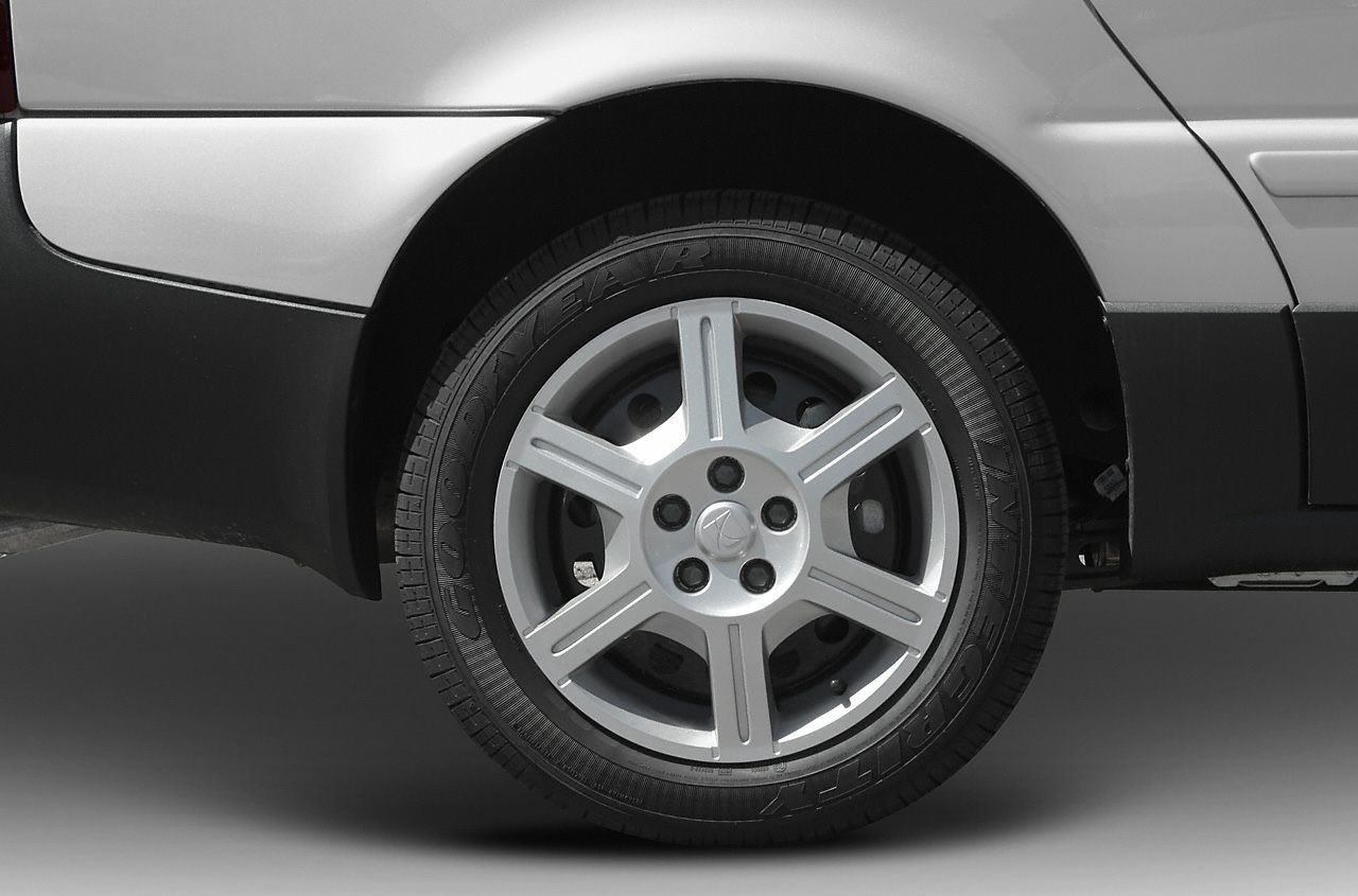 Five-spoke alloy wheel and Goodyear tire close-up