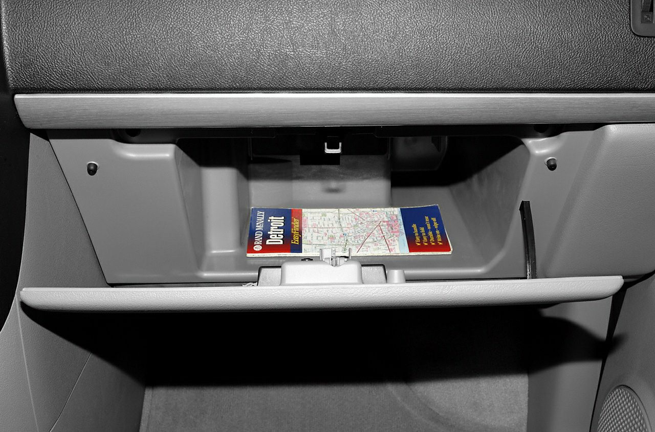 Open glove compartment with folded map inside