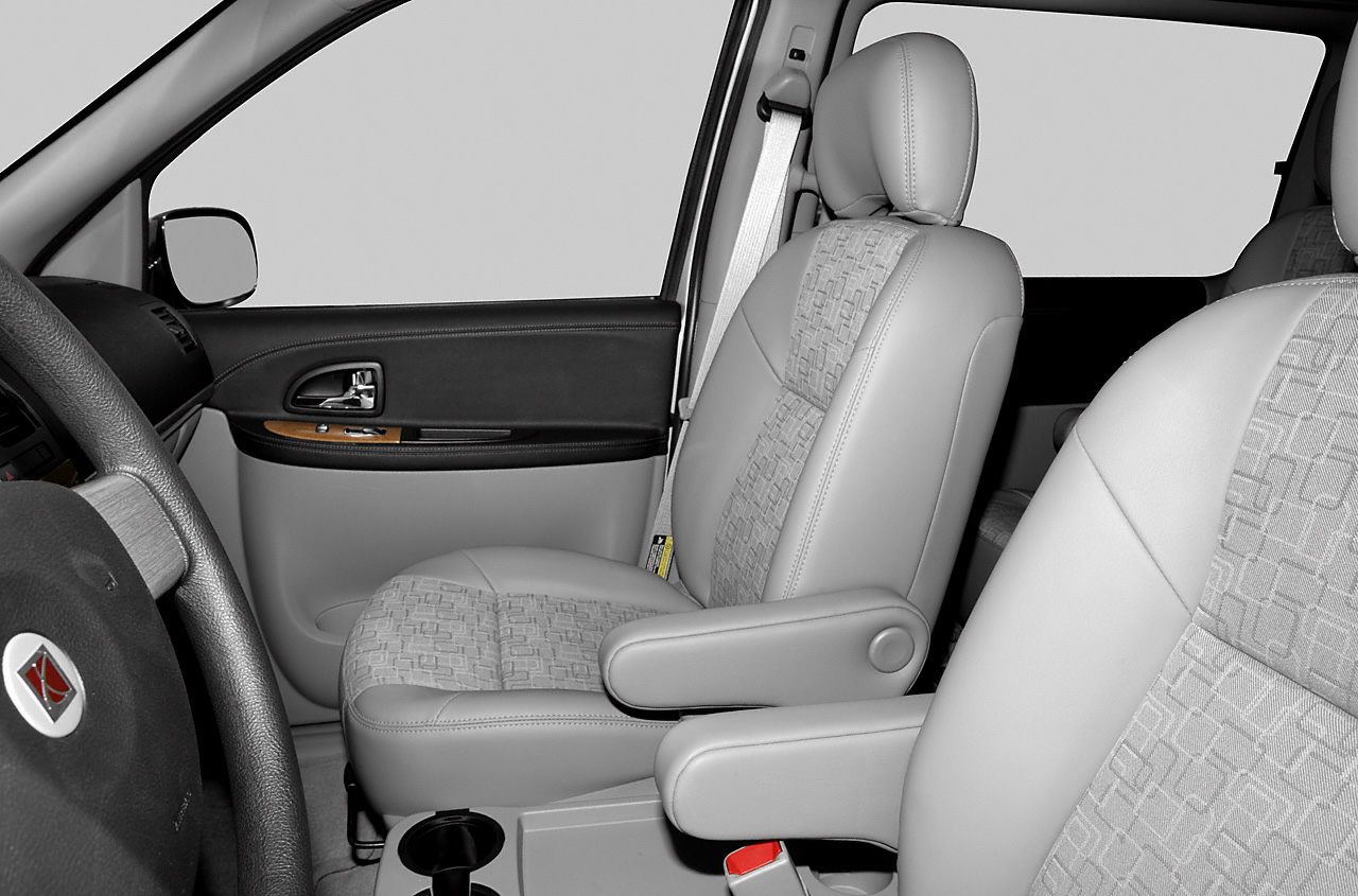 Front car seats with armrests and detailed door panel interior