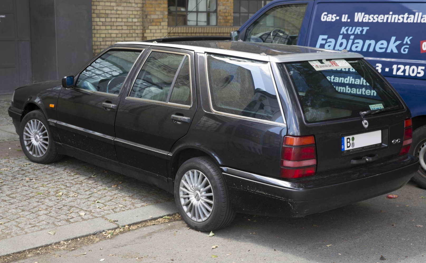 Rear and side profile of classic station wagon with alloy wheels
