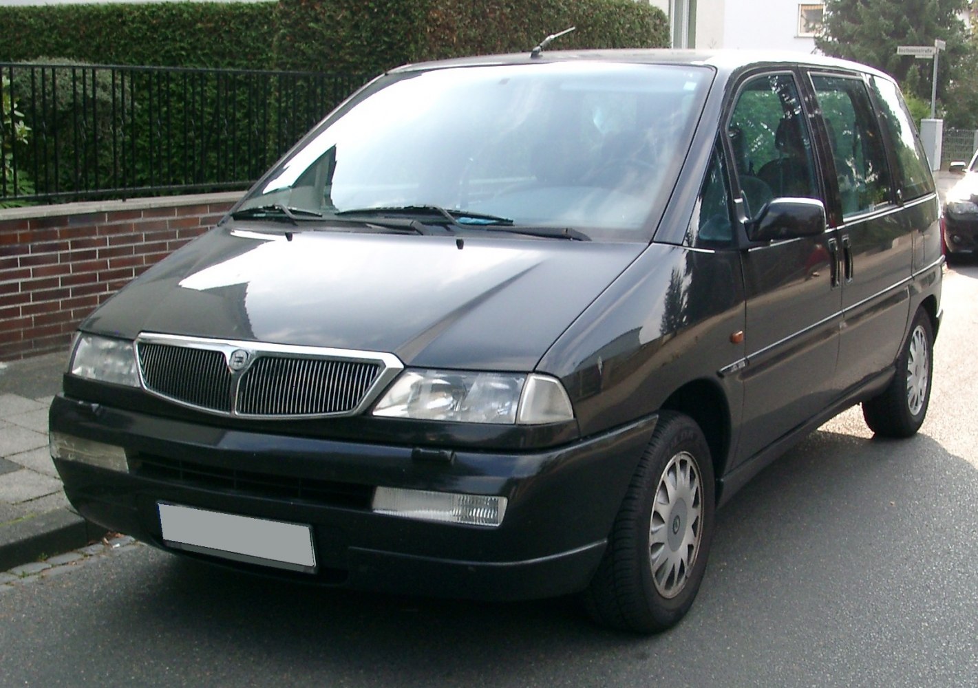 Front and side view of a minivan with distinctive grille and headlights