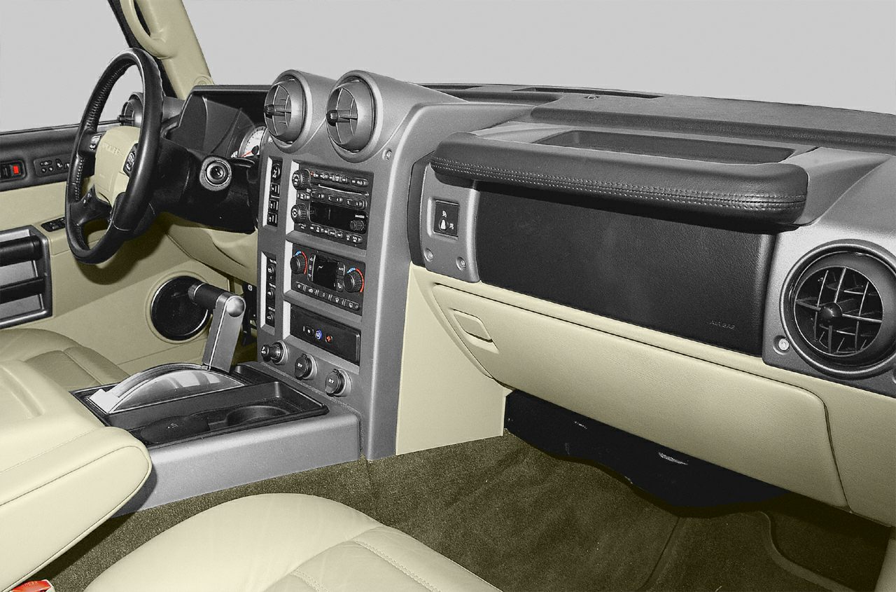 Dashboard, steering wheel, and center console with beige leather interior