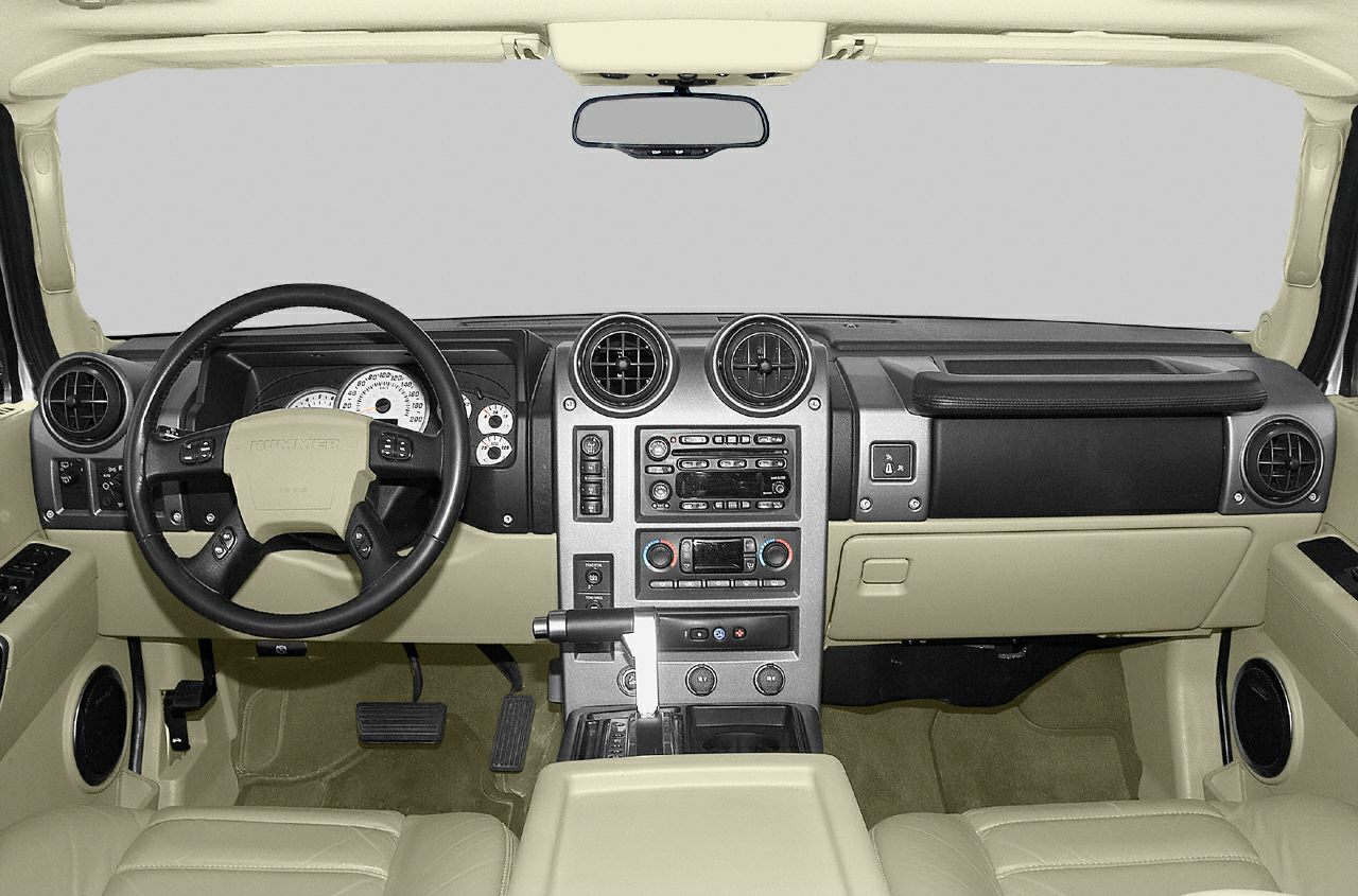 Beige dashboard, steering wheel, center console of SUV interior