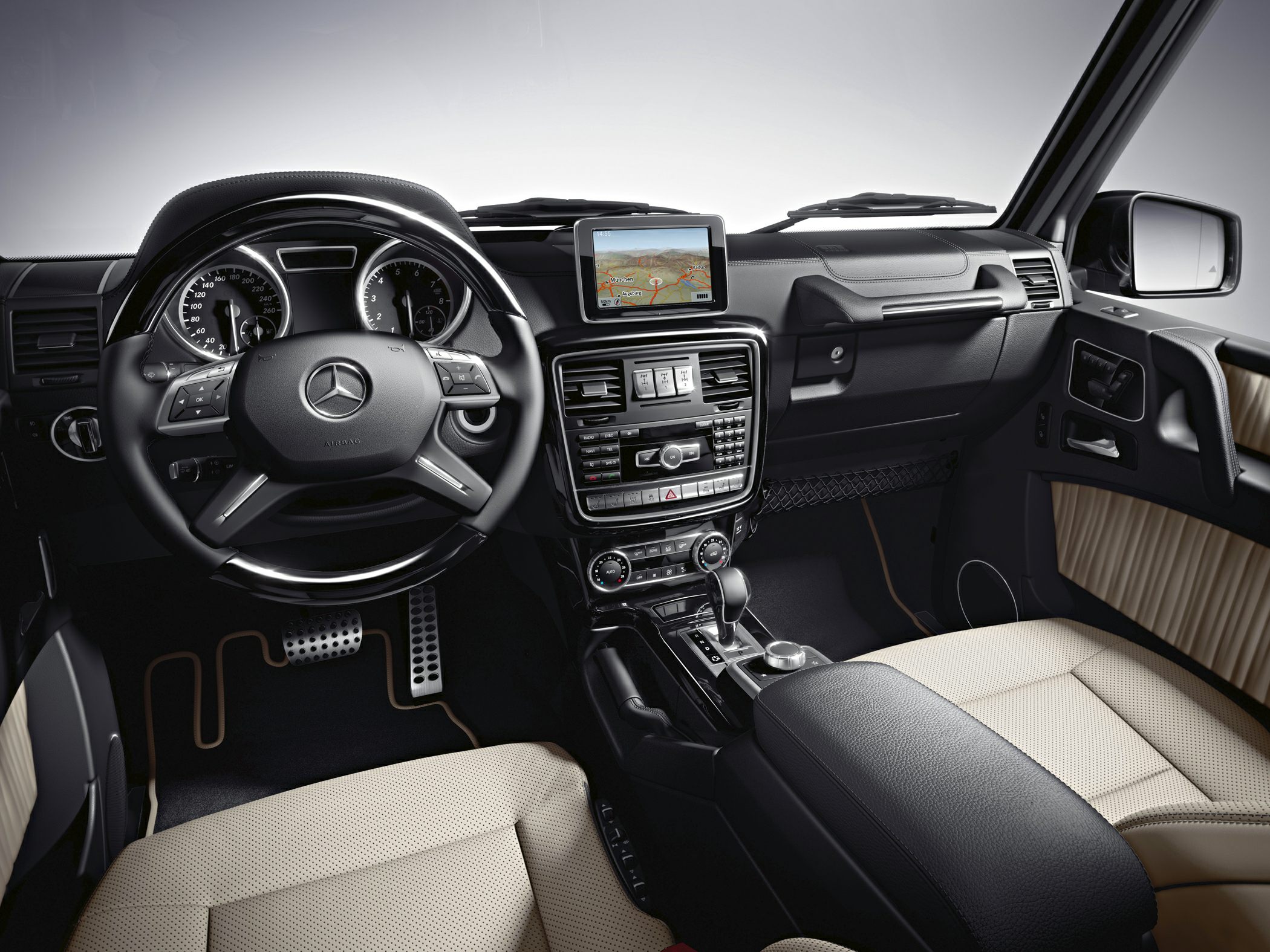 Luxury SUV interior with dashboard, infotainment screen, and steering wheel controls