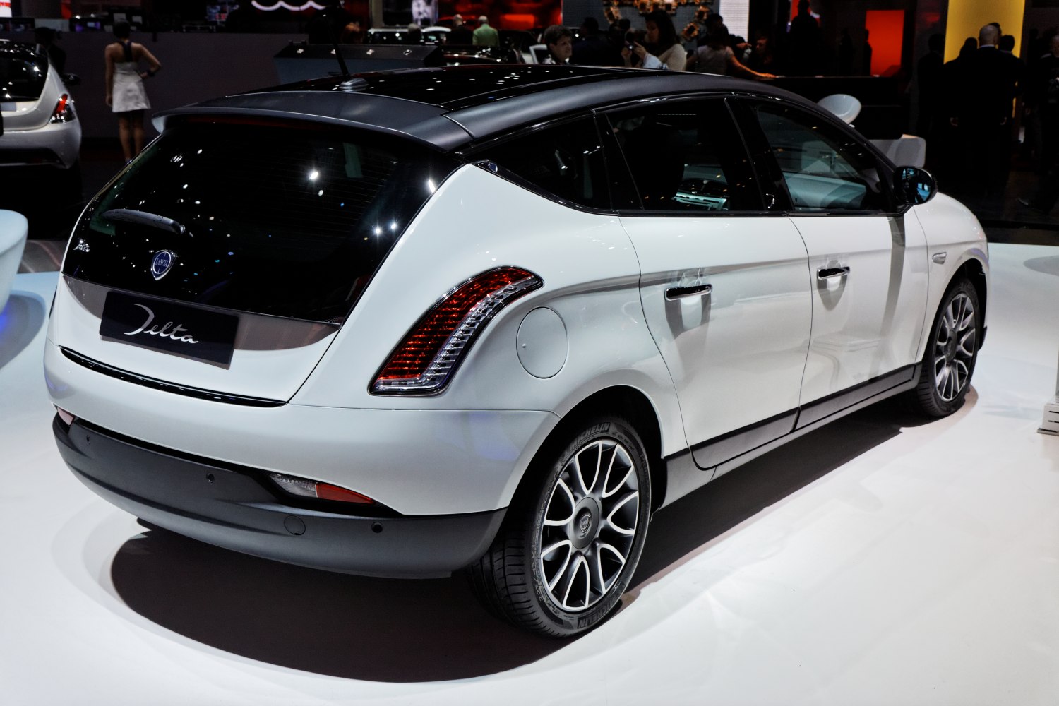 Rear side view of a hatchback with distinctive taillights and two-tone roof