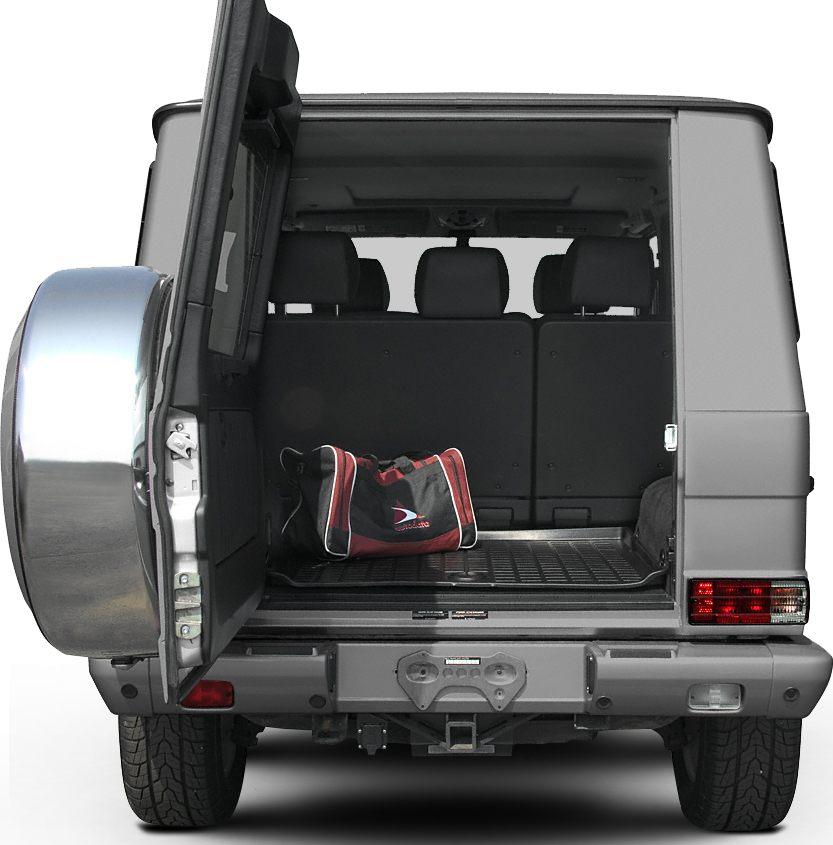 Rear open tailgate showing spacious cargo area with folded seats and bag