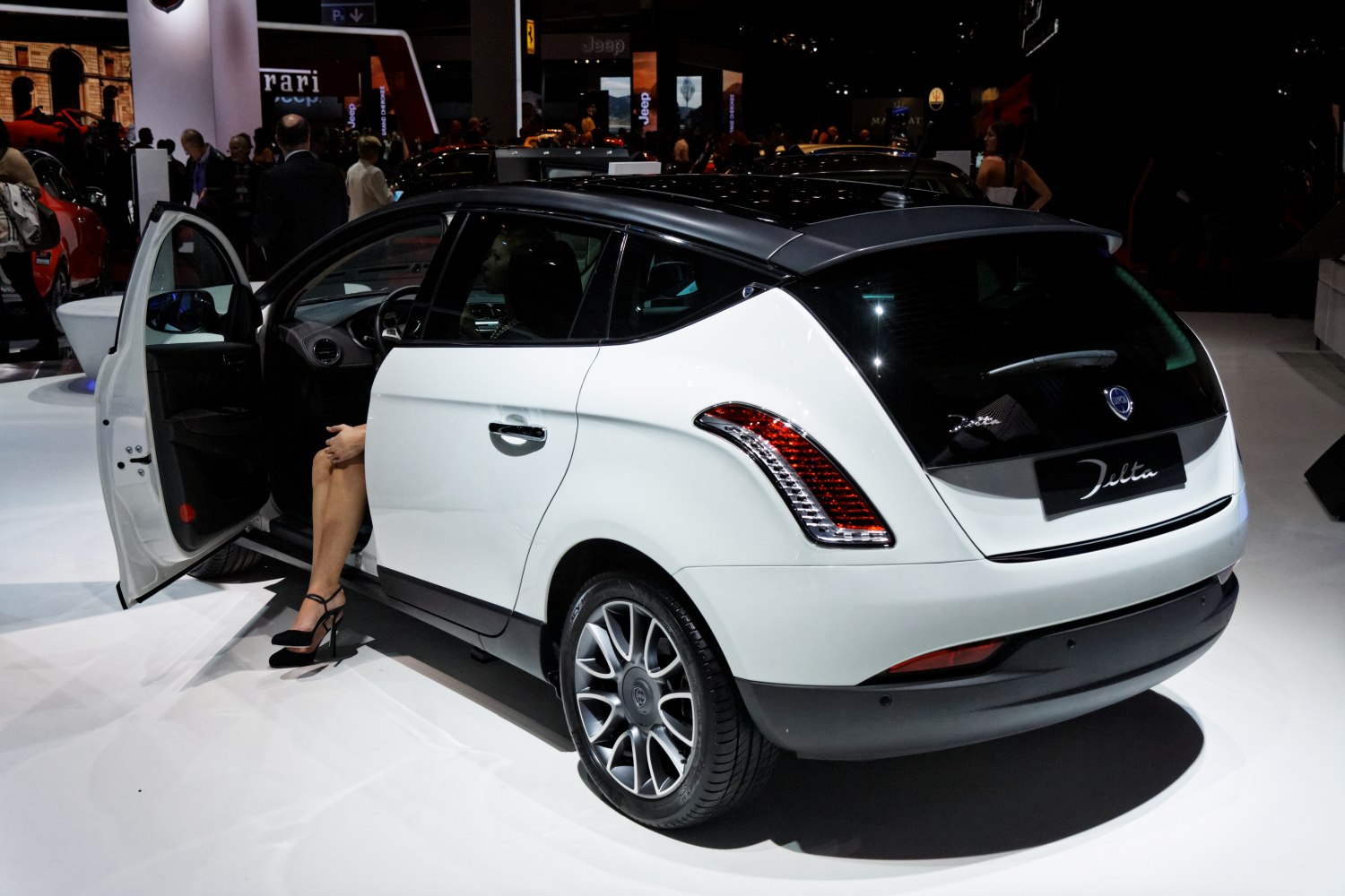 Rear and side view with distinctive taillights and black roof