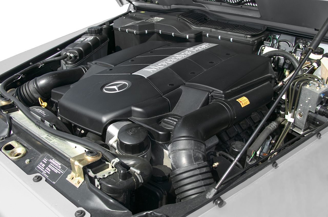 Mercedes-Benz engine bay with detailed components and V8 cover