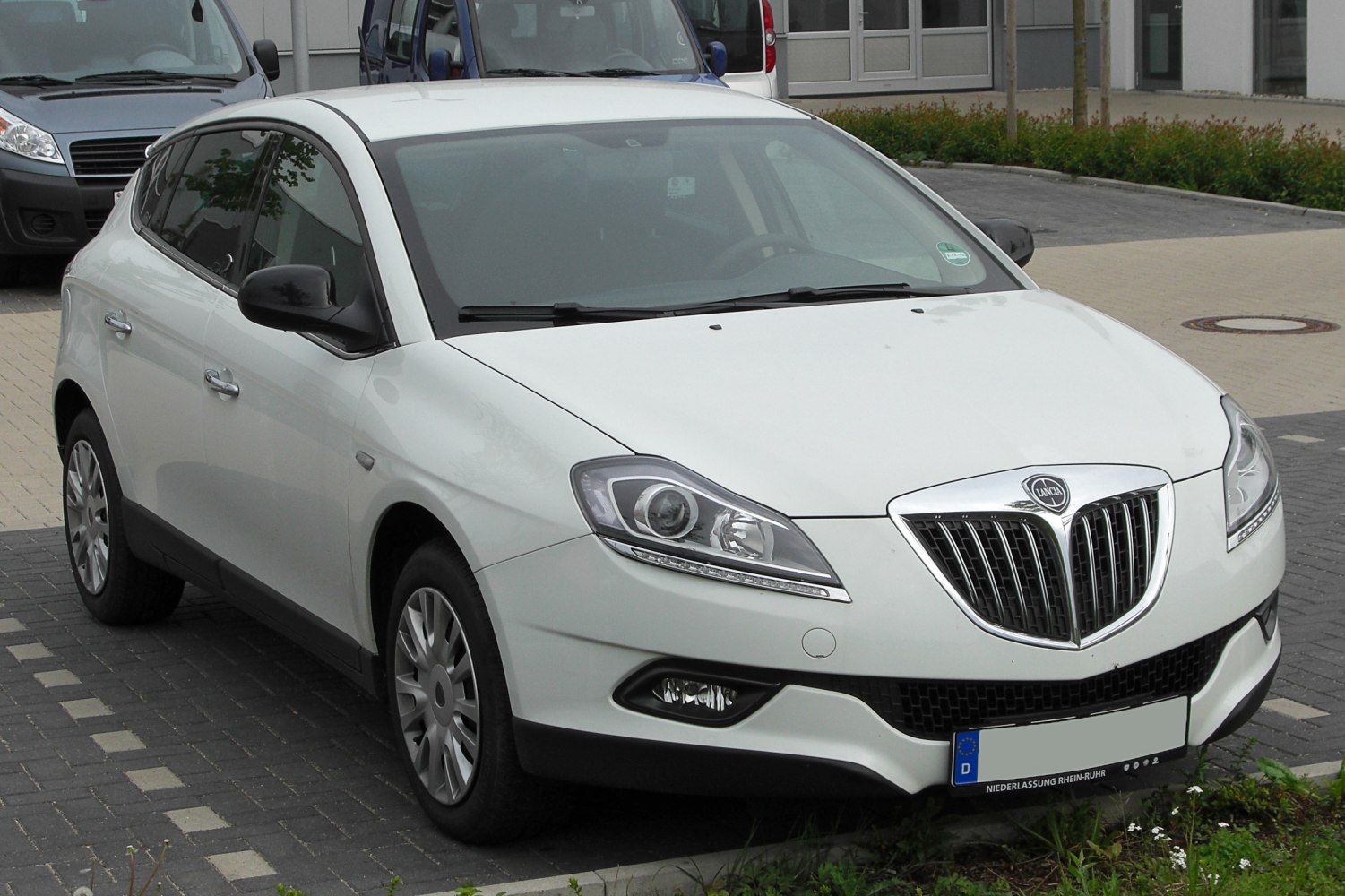 Front and side view with distinctive grille and headlights