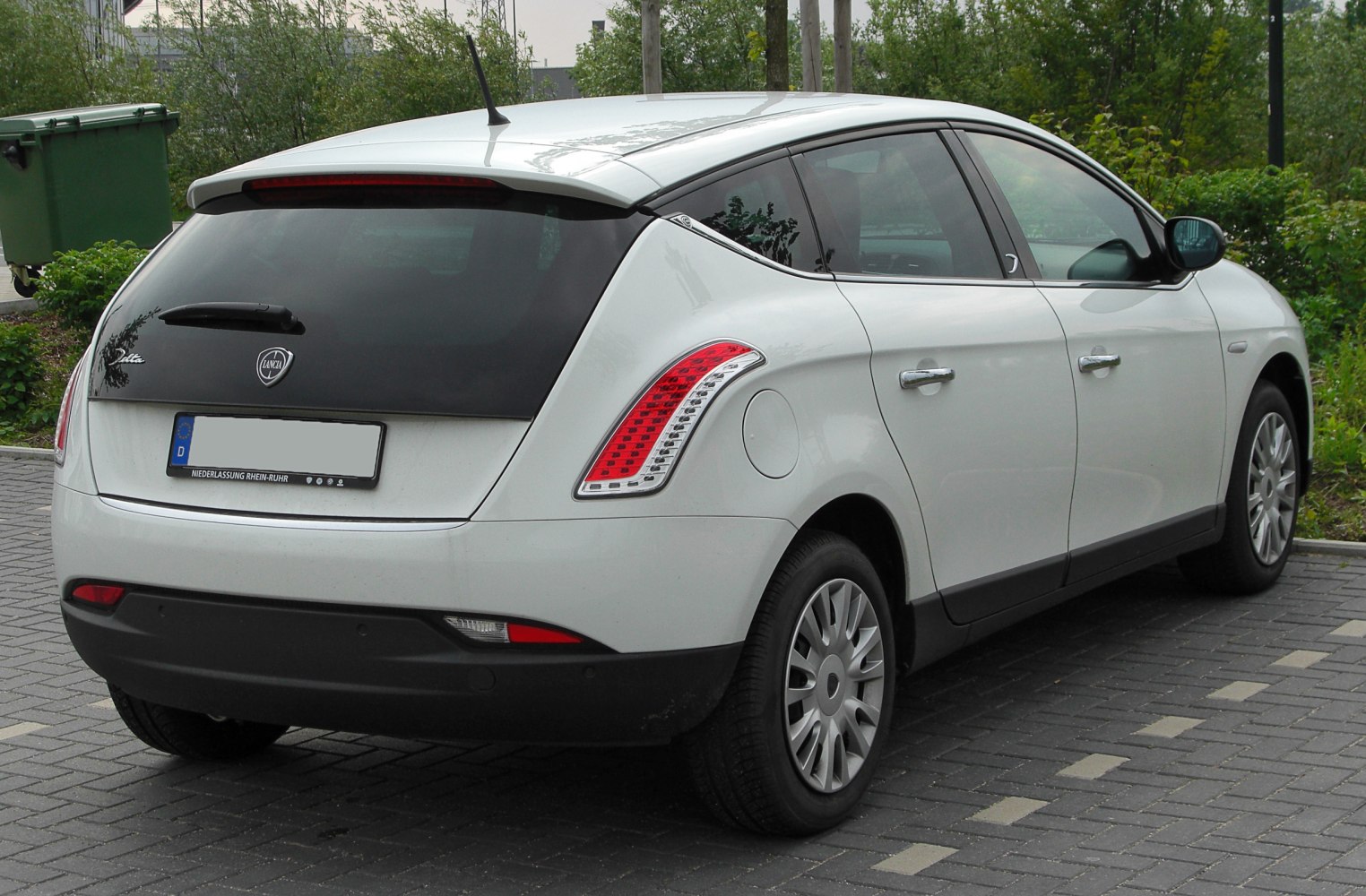 Rear and side view of a hatchback with unique taillights and rear window design