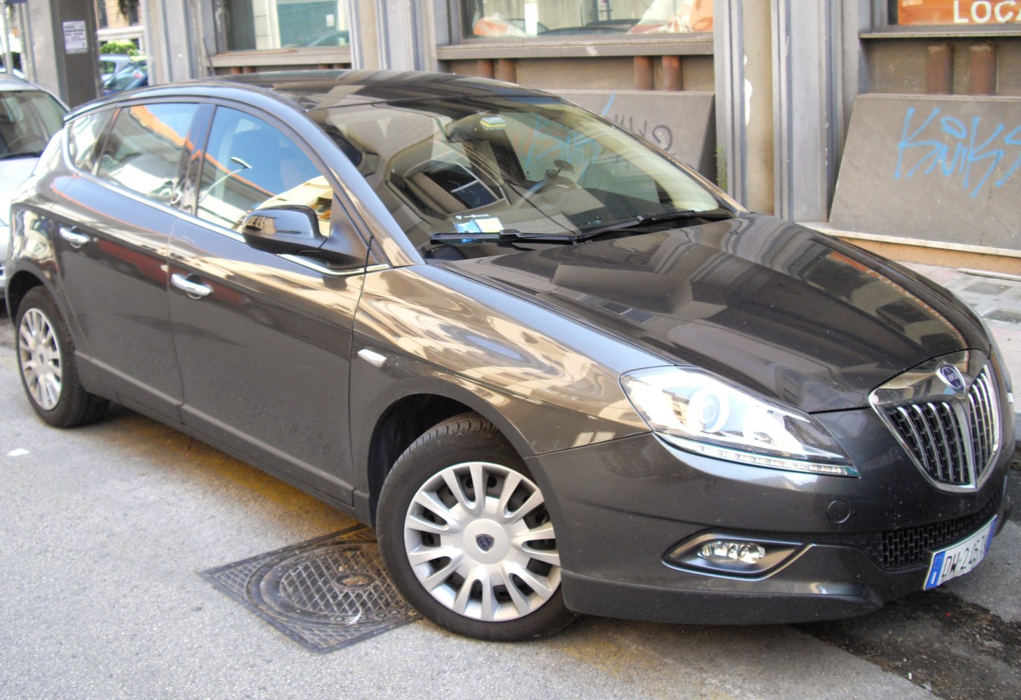 Front-side view featuring distinctive grille and headlights