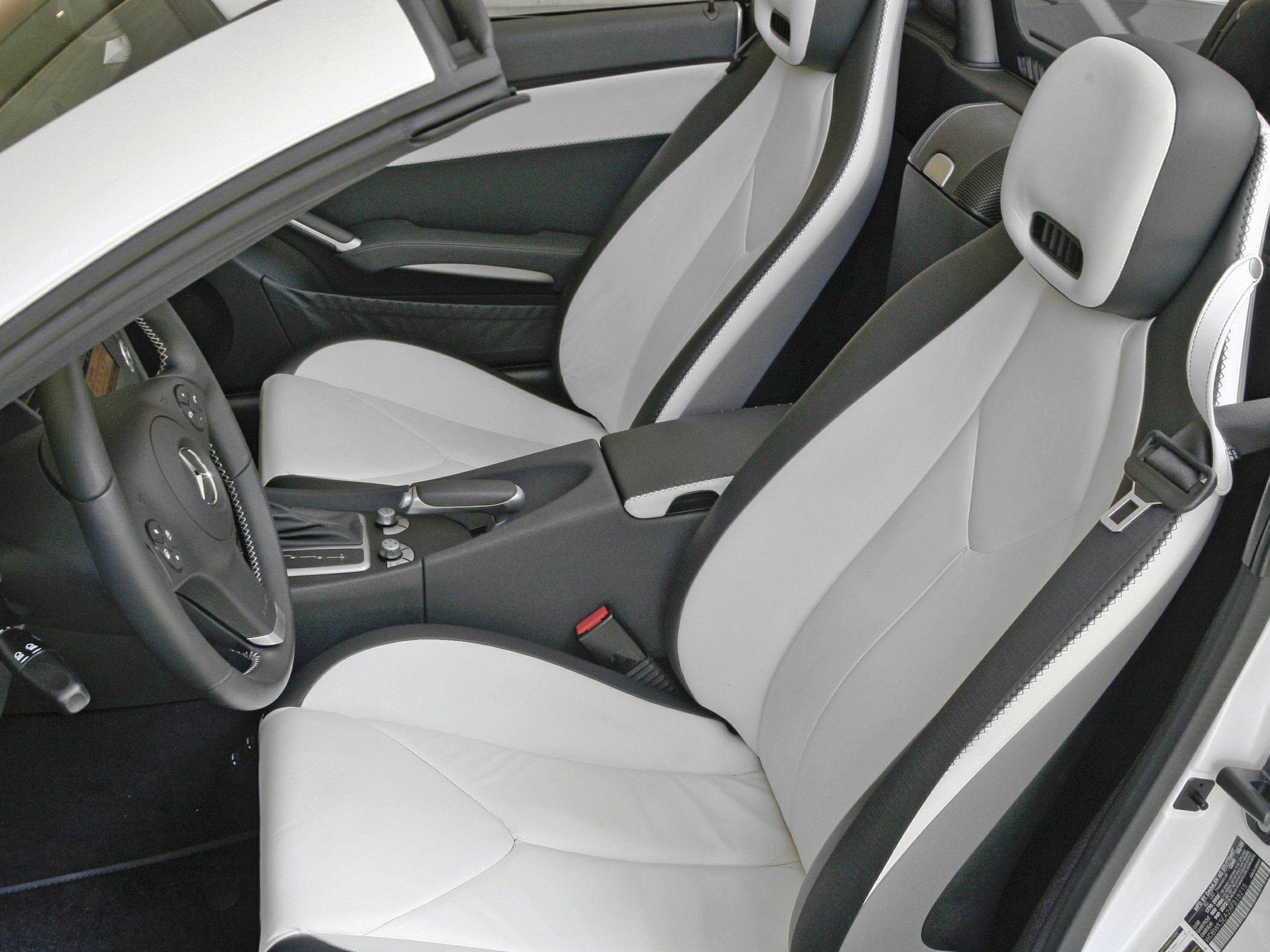 Two-tone leather bucket seats with center console and steering wheel
