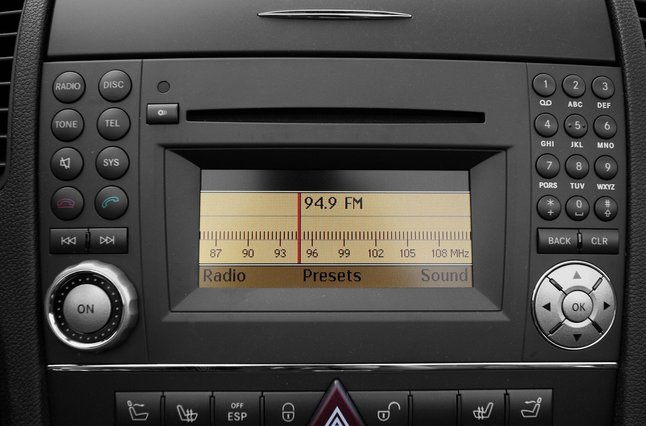 Car radio display and control panel with FM tuner and multifunction buttons
