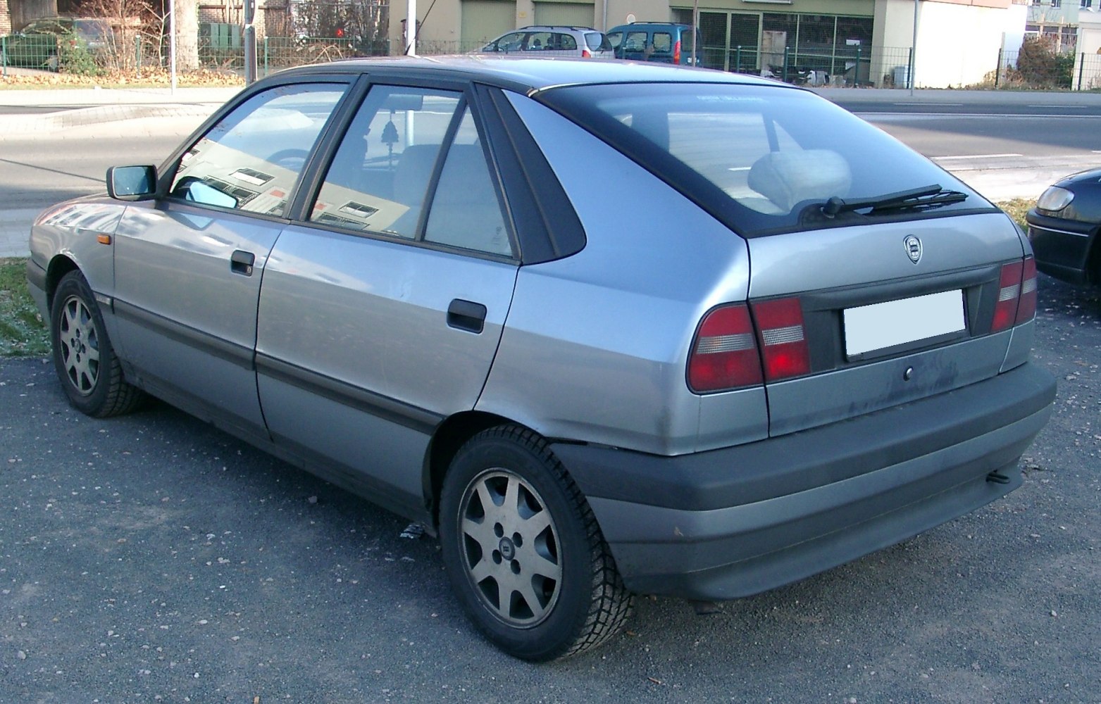 Hatchback rear side view with taillights and spoiler