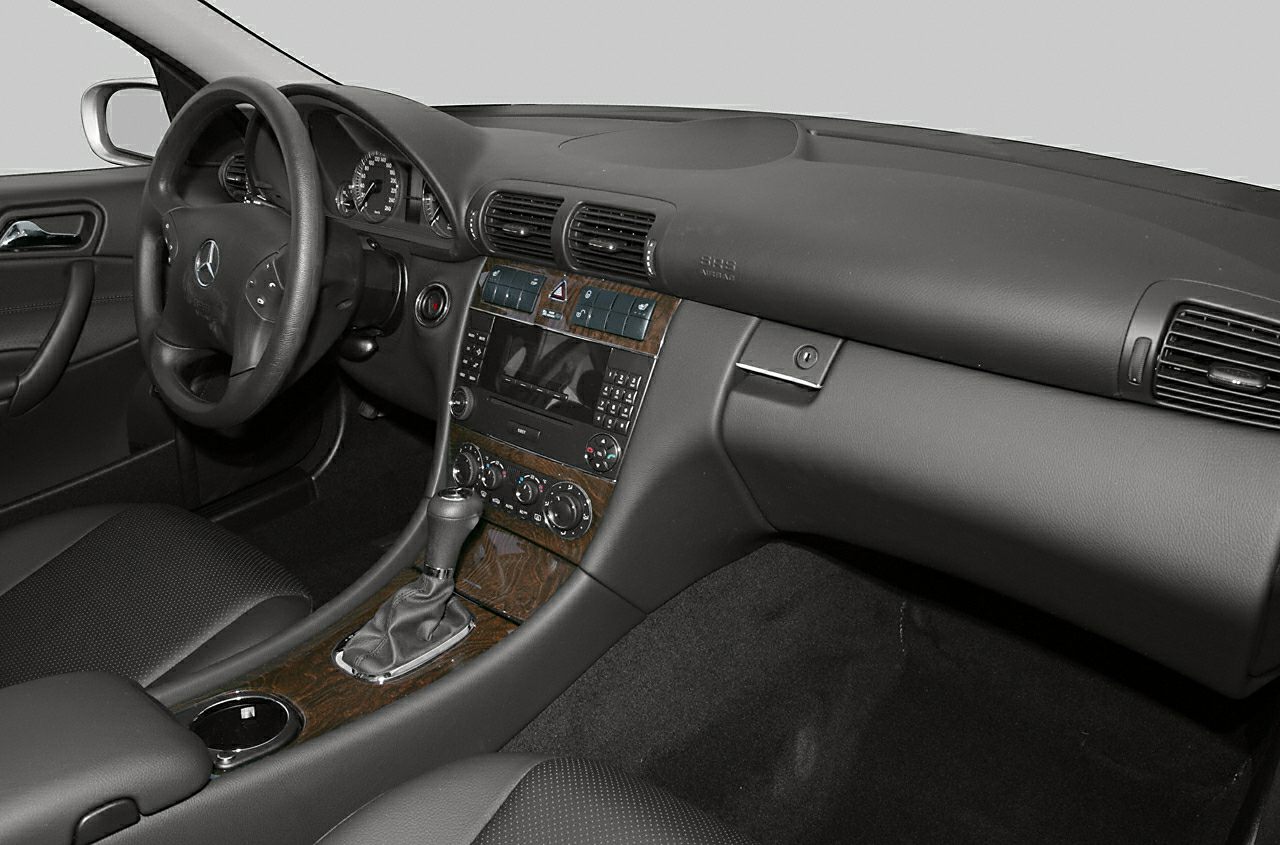 Interior dashboard with wood trim and automatic gear shift