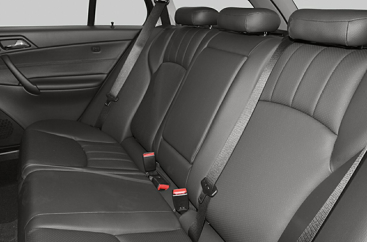 Leather rear seats with headrests and seat belts in a car