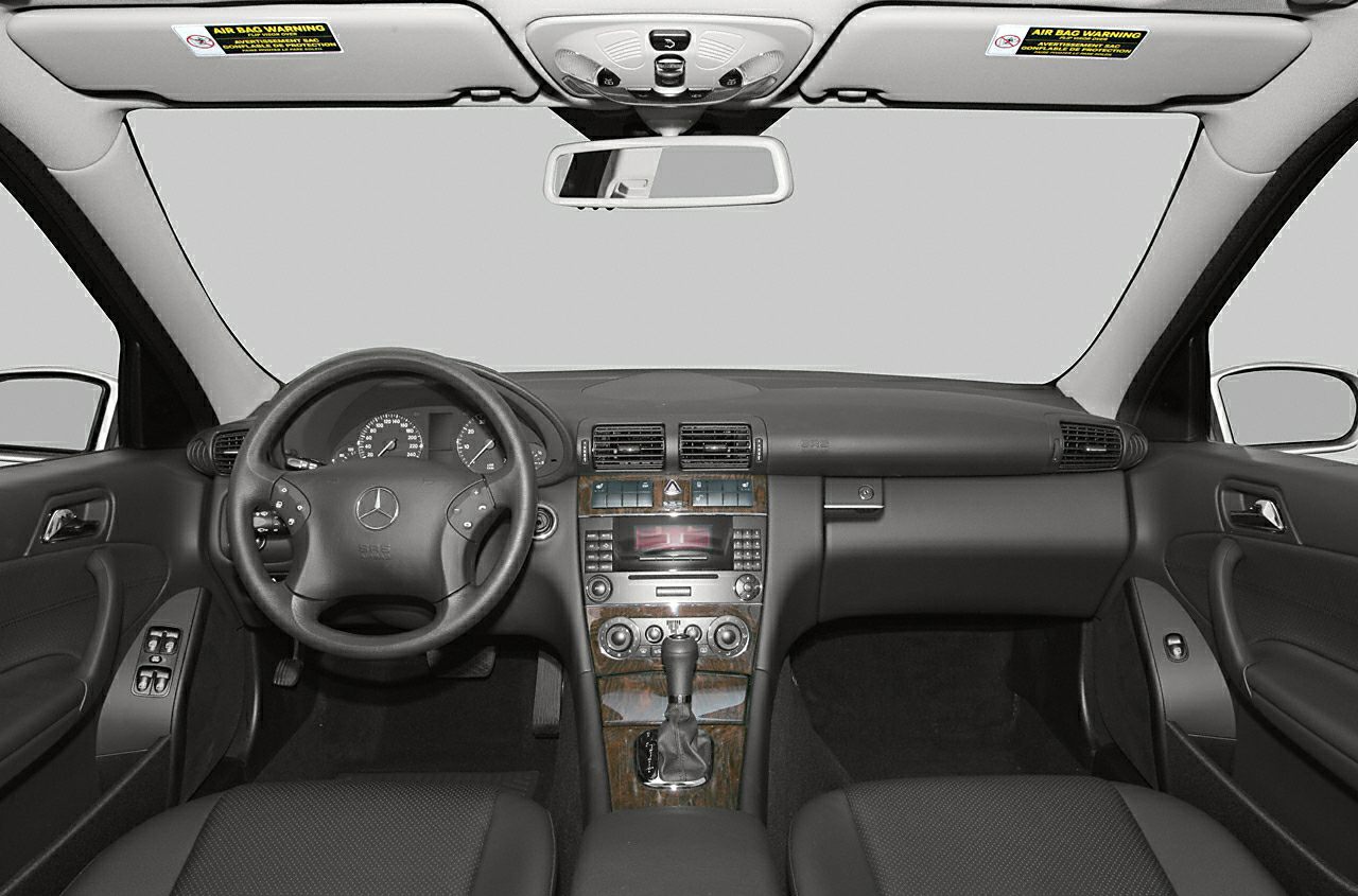 Dashboard and steering wheel with wood trim center console view
