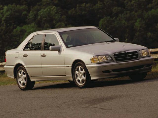 Front side view of a silver sedan with alloy wheels and distinctive grille