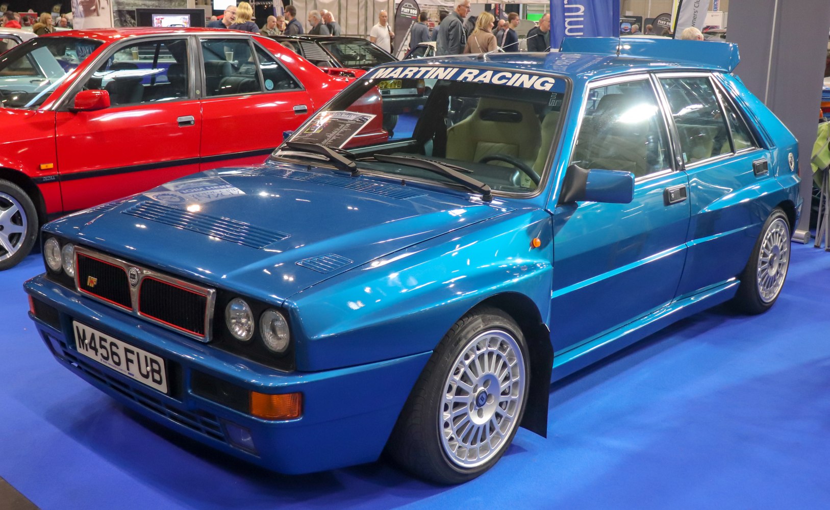 Rally-style hatchback with Martini Racing decal and rear spoiler