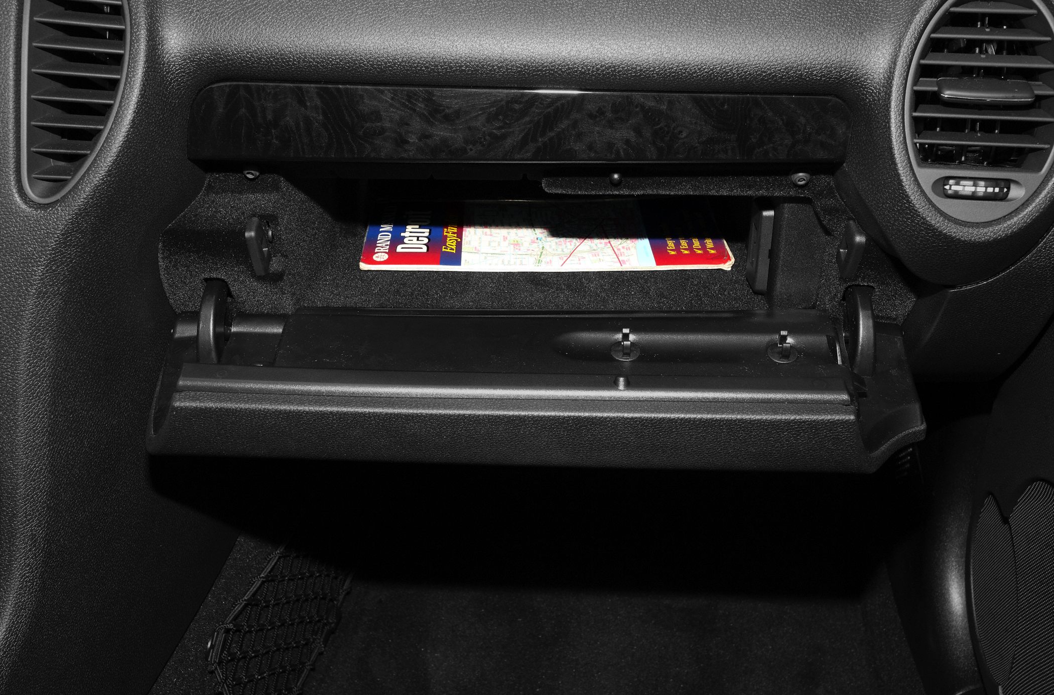 Open glovebox with dashboard air vents