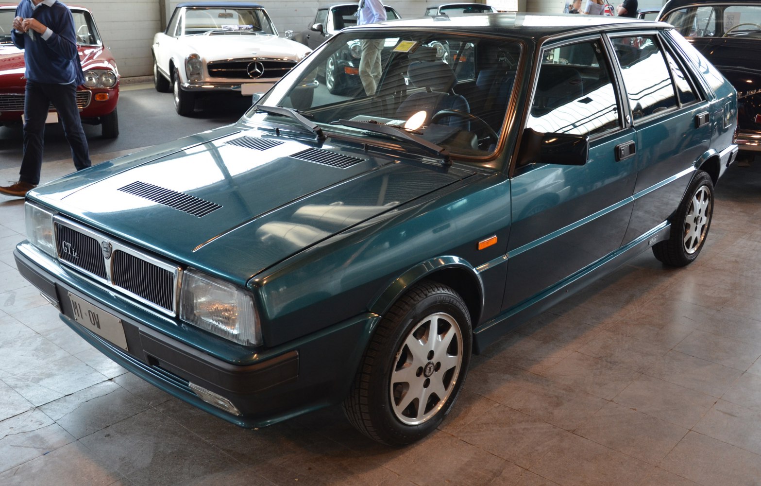Classic hatchback with boxy design and alloy wheels, front three-quarter view