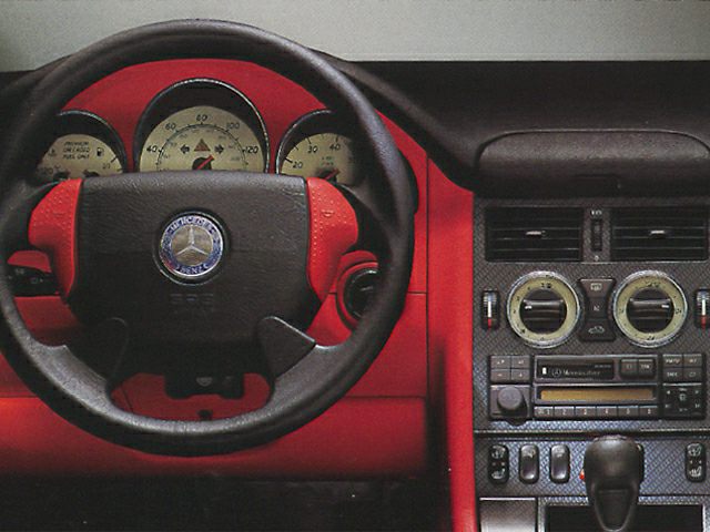 Classic Mercedes-Benz steering wheel and dashboard with gauges and controls