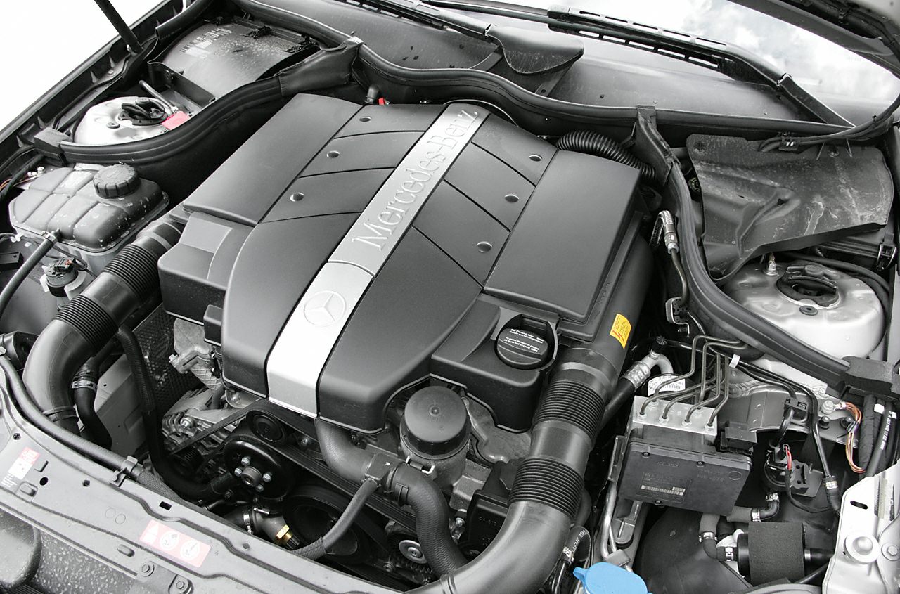 Detailed engine bay with large Mercedes-Benz branded engine cover