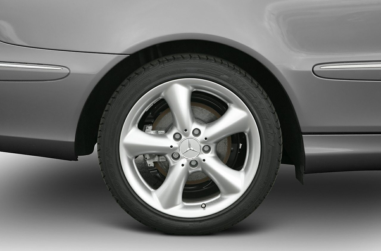 Close-up of five-spoke alloy wheel and Michelin tire.