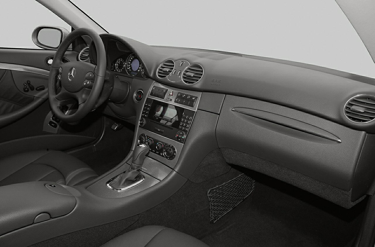 Dashboard and steering wheel with center console and air vents