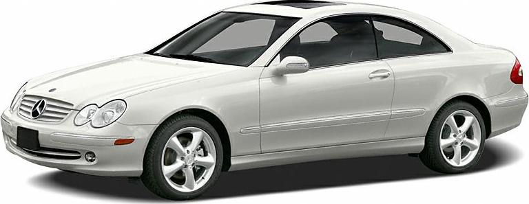 Side profile of a 2002 luxury coupe with alloy wheels and distinct headlights