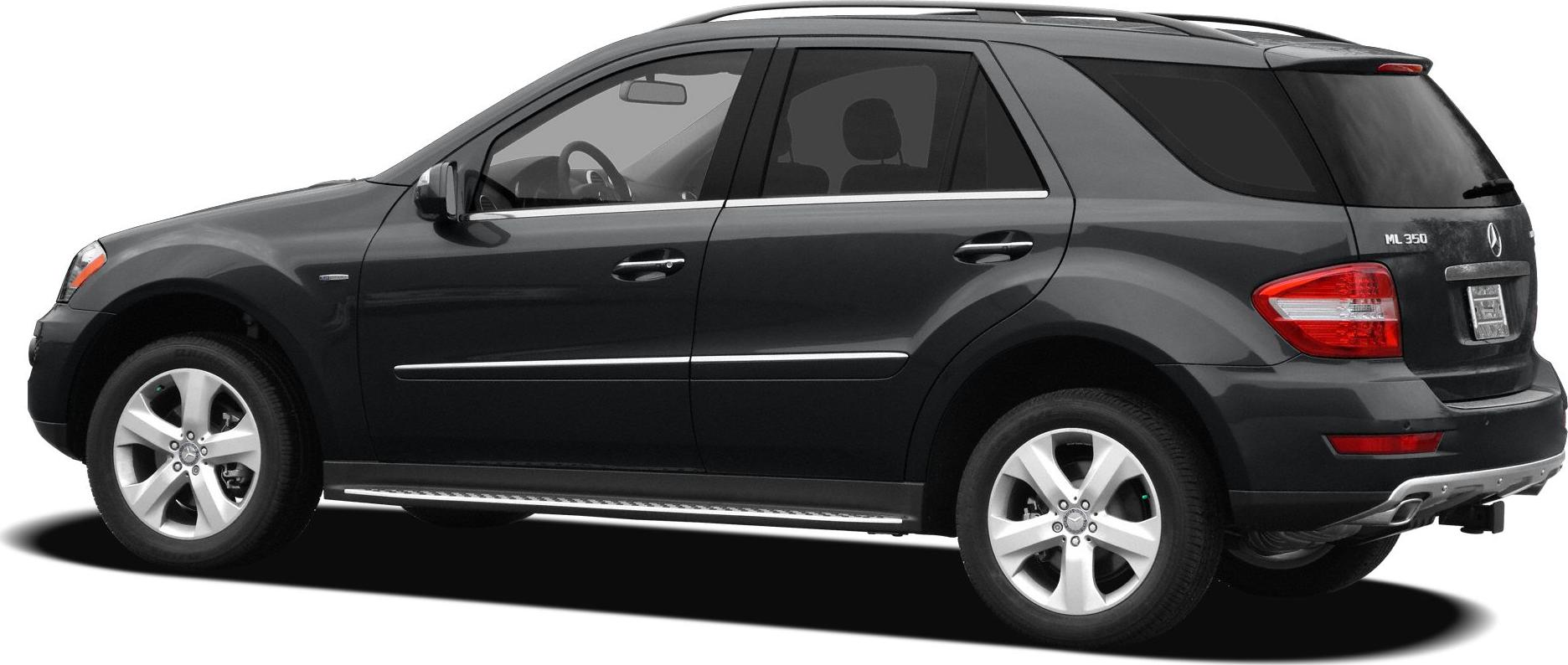 Side profile of black SUV with alloy wheels and running boards
