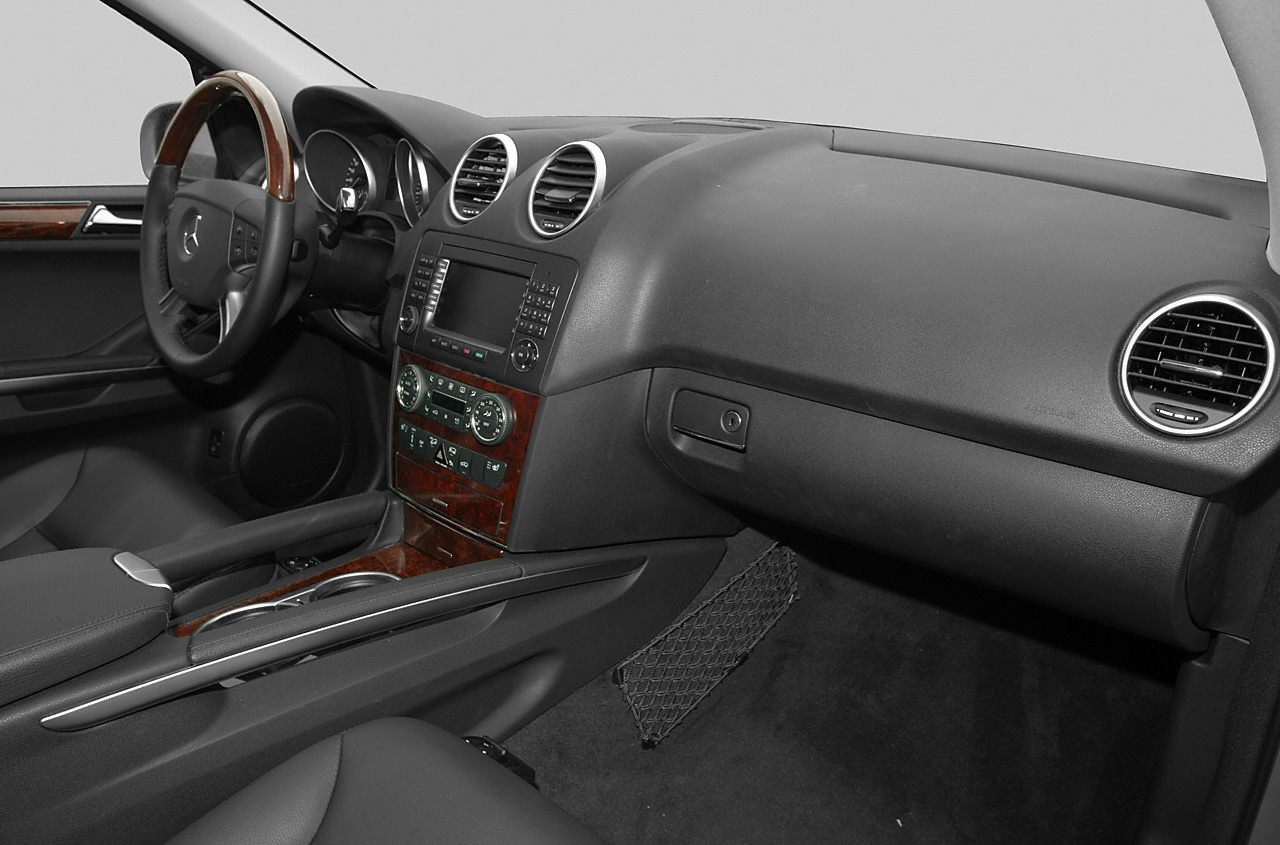 Dashboard and wood trim interior with instrument cluster