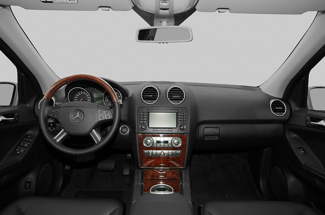Dashboard and wood-trimmed steering wheel with central control panel