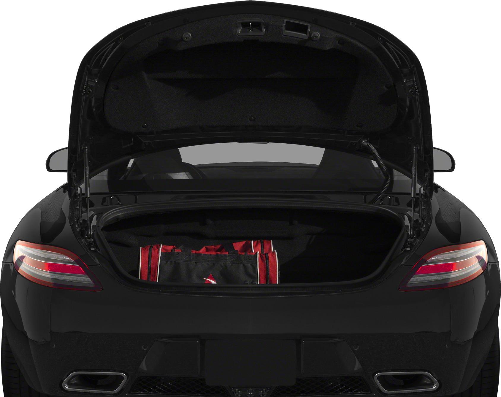 Rear trunk open with luggage in a black coupe showing taillights.