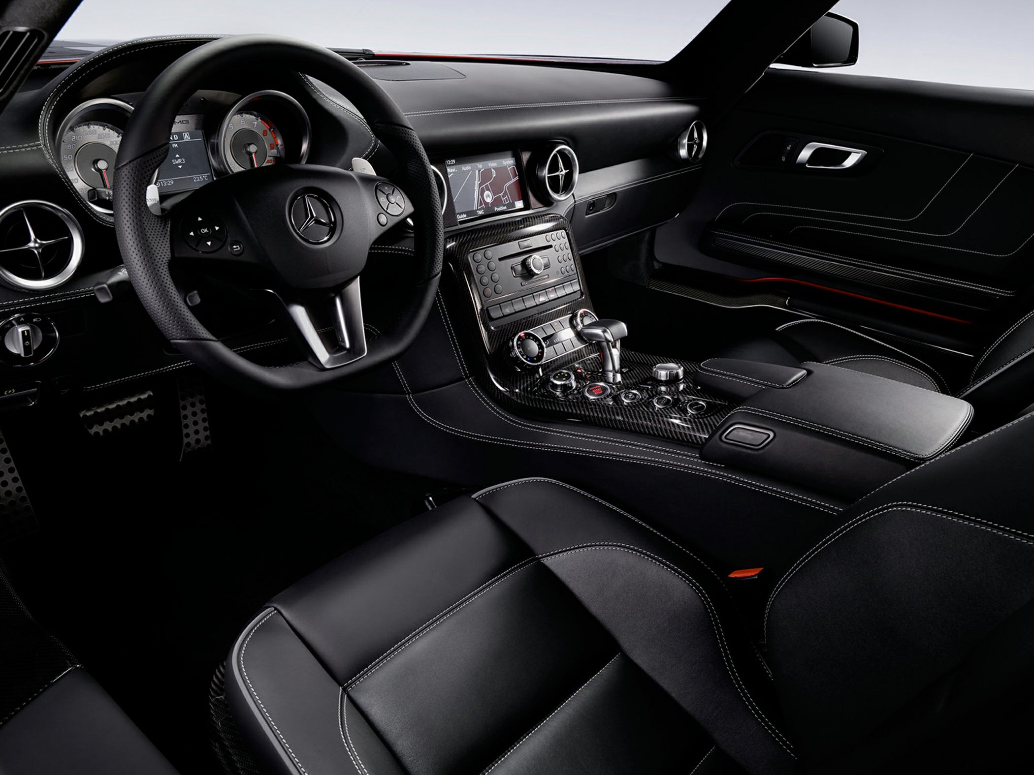Luxurious dashboard and center console with advanced controls and leather seats.