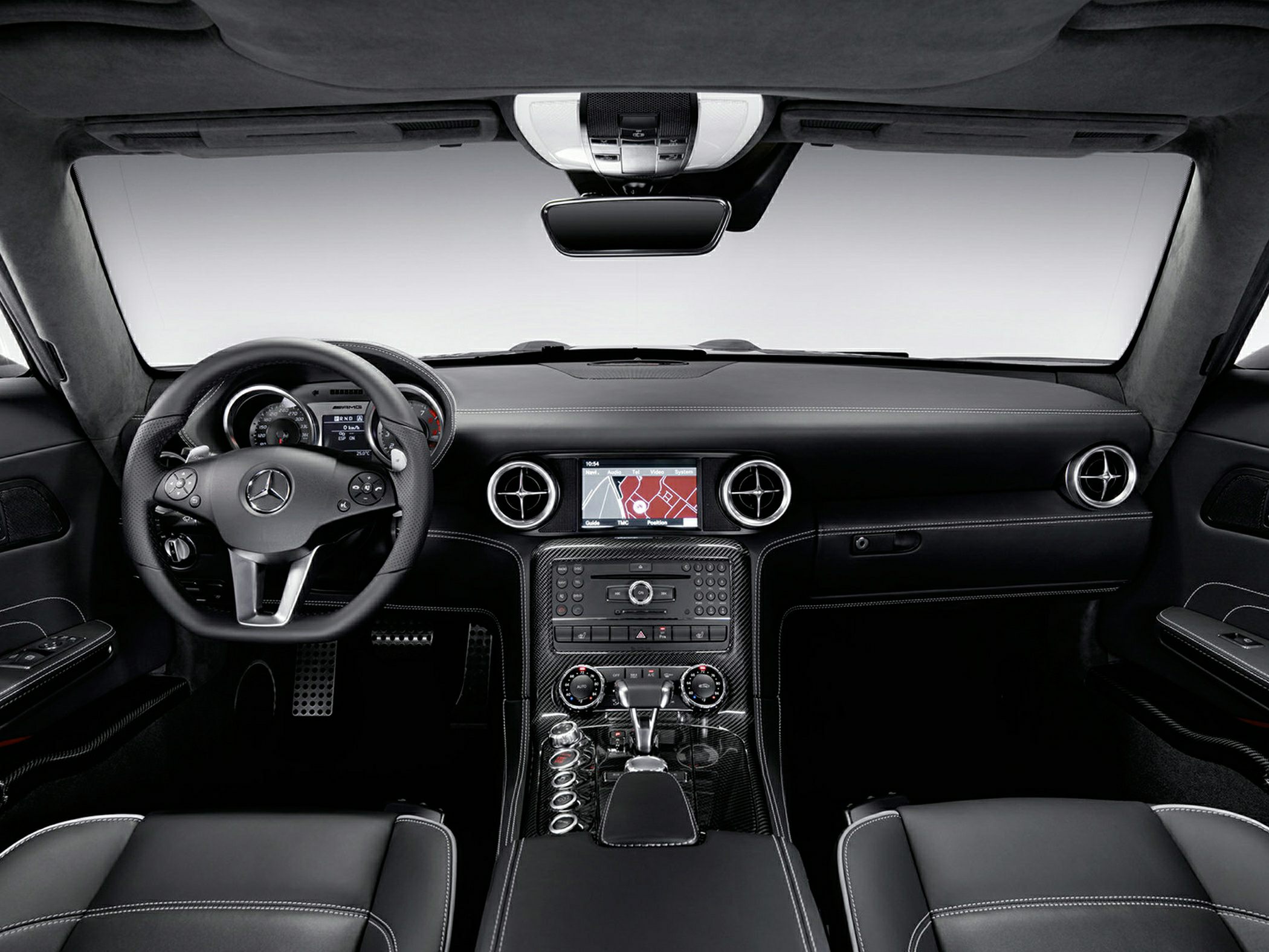 Black leather interior with sporty steering wheel and carbon fiber center console
