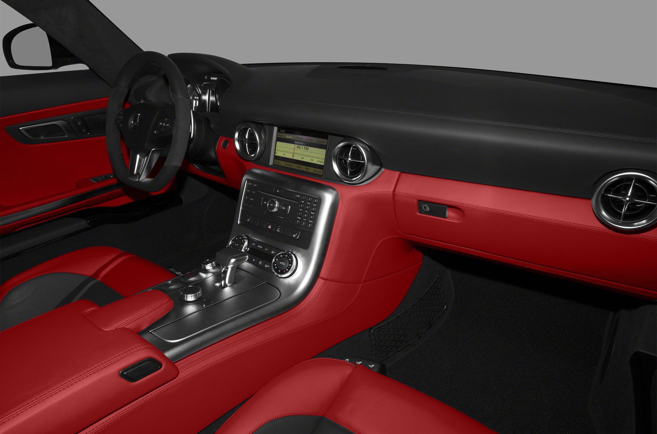 Red and black leather interior with modern dashboard and center console