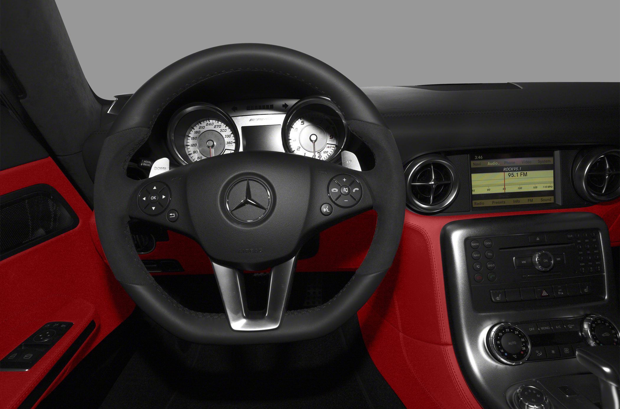 Luxury steering wheel and dashboard with AMG instrument cluster and red leather accents