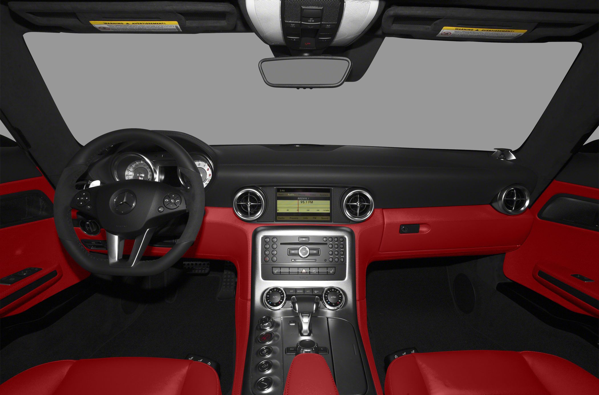 Red leather interior with dashboard, steering wheel, and center console.