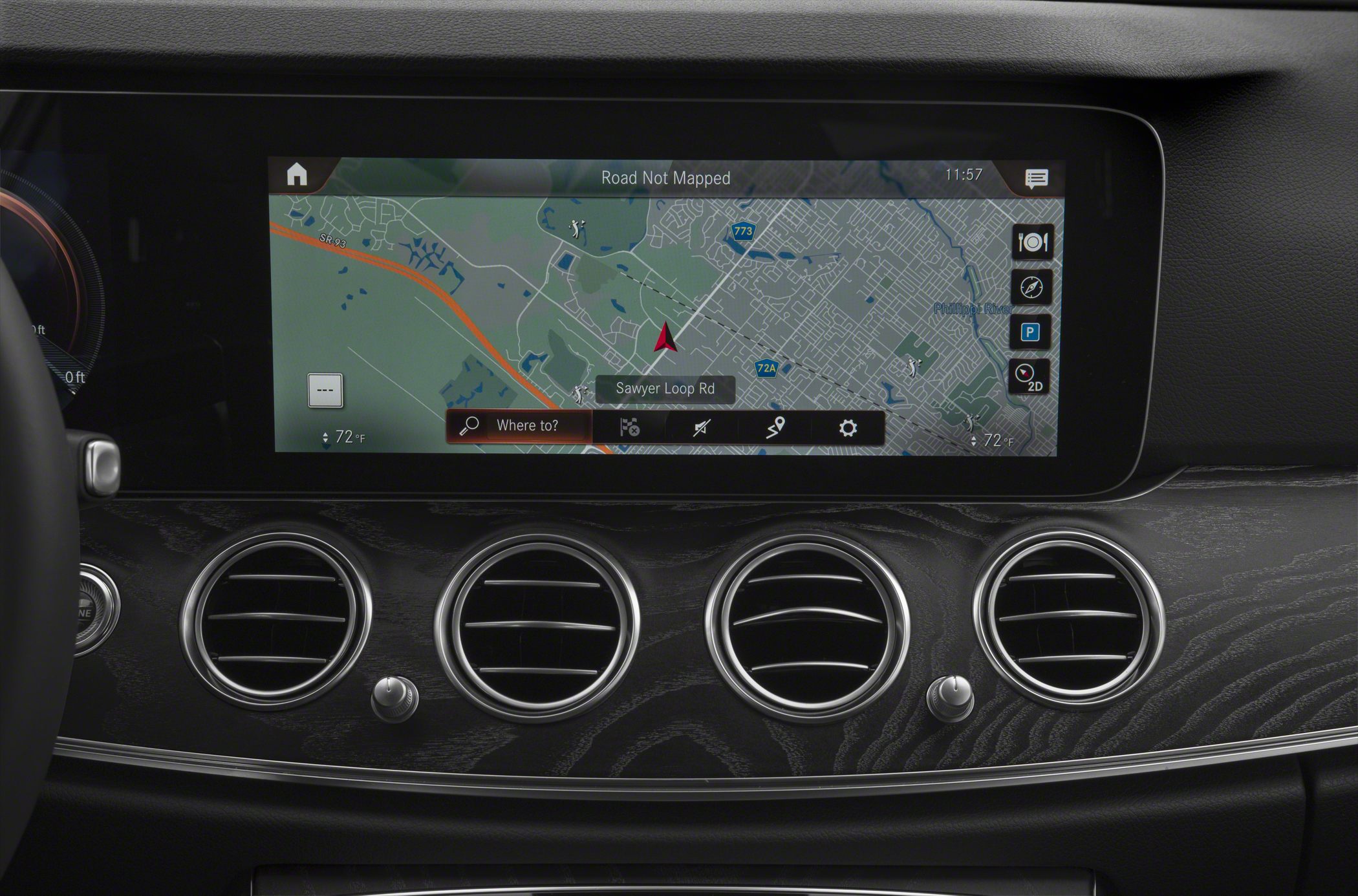 Digital navigation display with four circular air vents on car dashboard