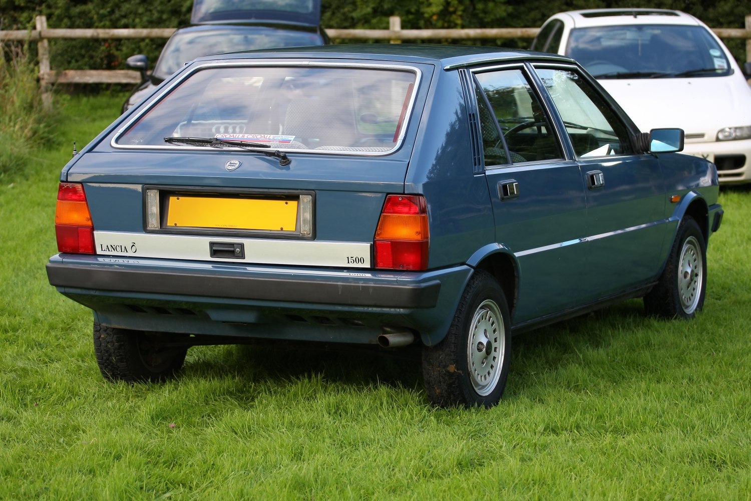 Rear hatchback with rectangular tail lights and rear window wiper