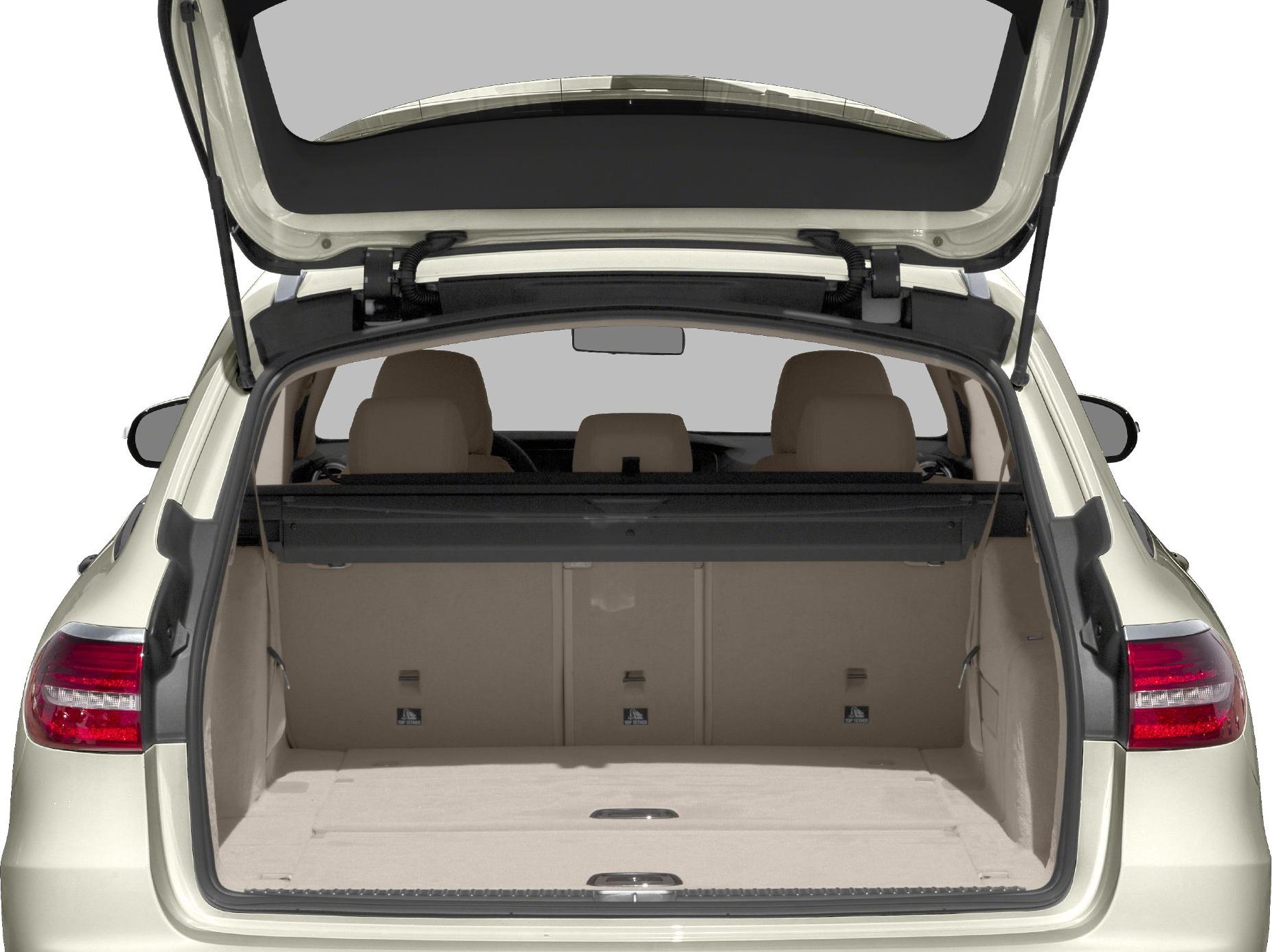 Open rear hatch showing large beige cargo area and rear seats.