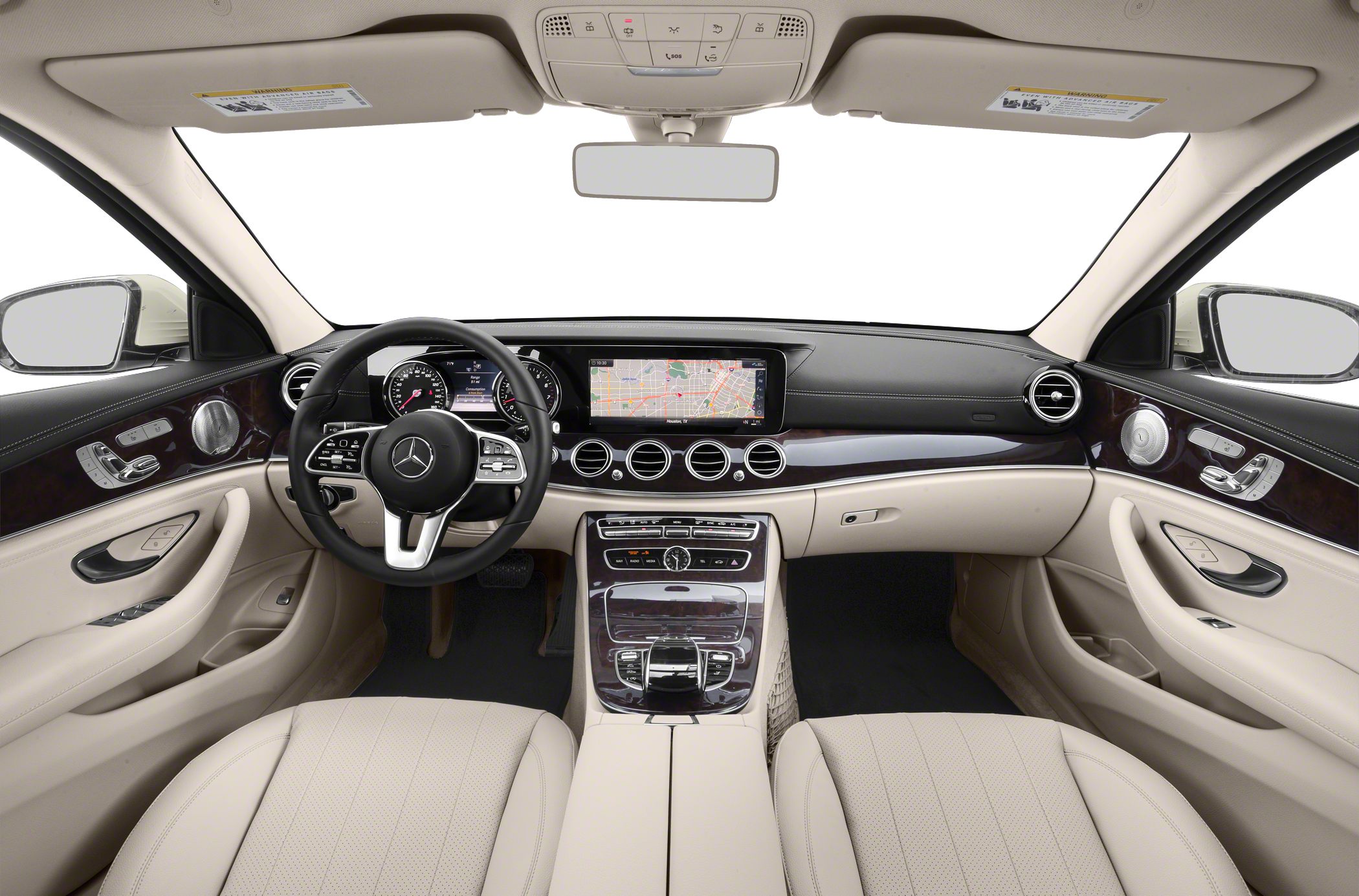 Beige leather seats and steering wheel with digital dashboard and wood trim.