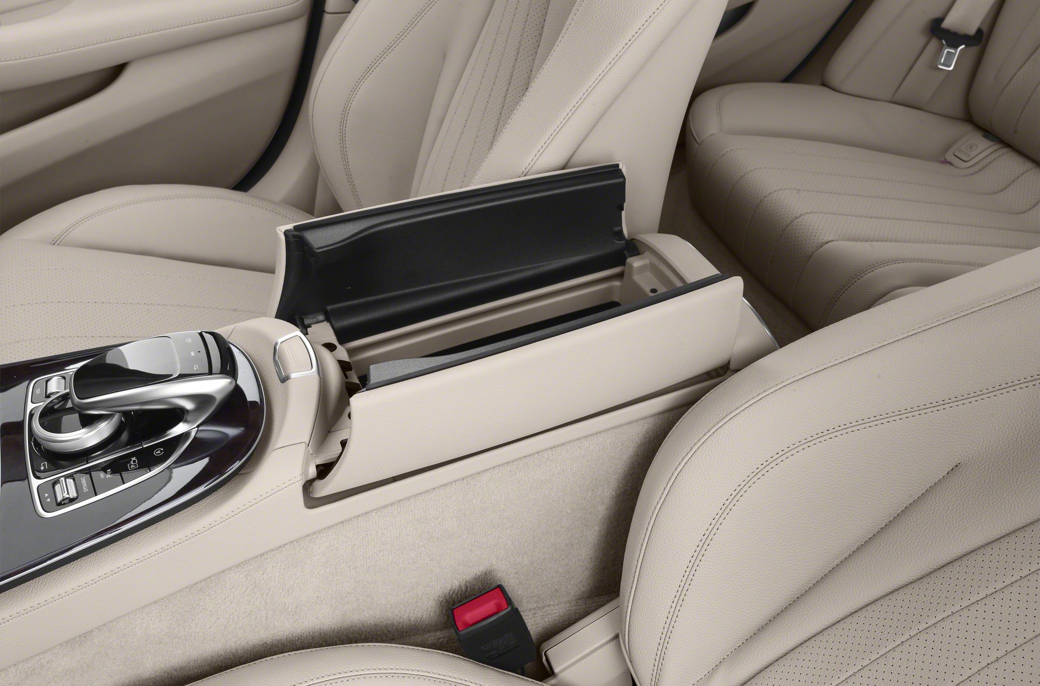 Beige leather seats with center console and open armrest storage