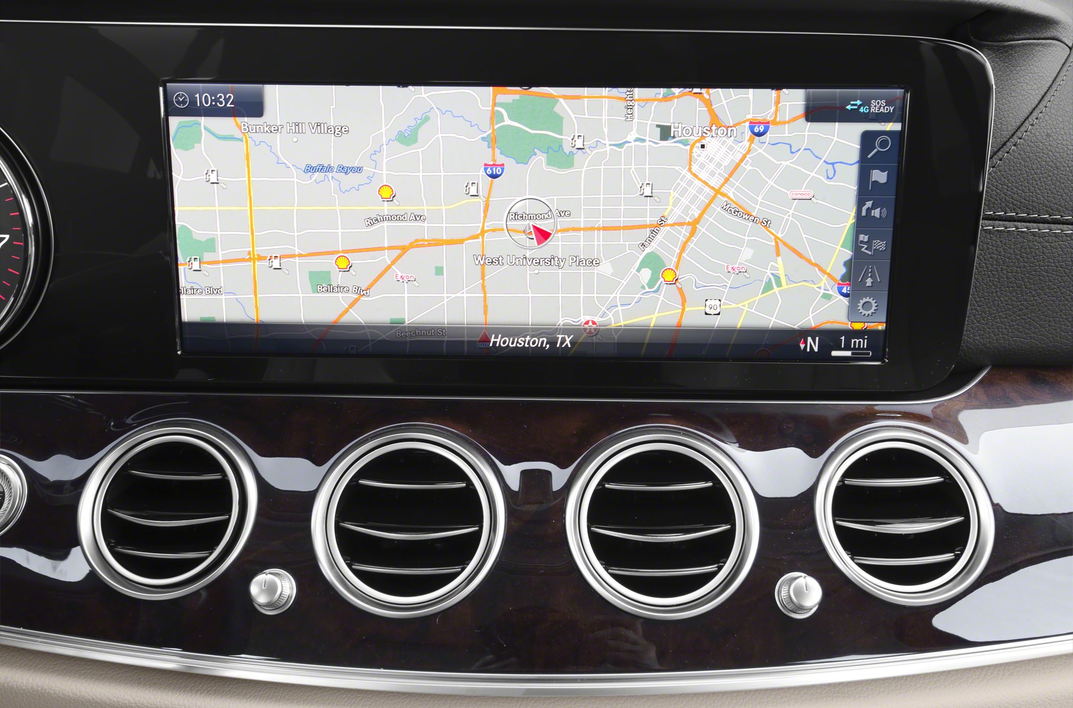 Car interior with digital navigation display and circular air vents