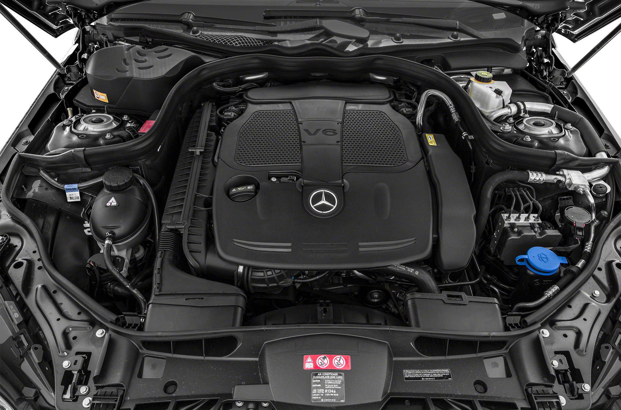 V6 engine bay with prominent engine cover and Mercedes emblem