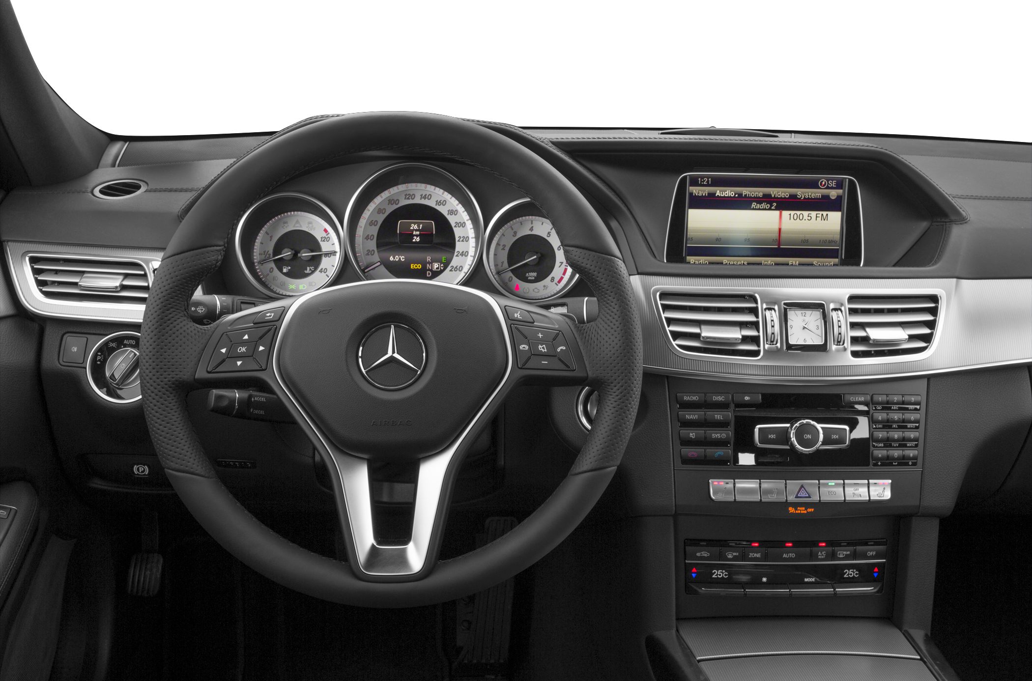 Steering wheel, analog gauges, infotainment screen, and dashboard controls