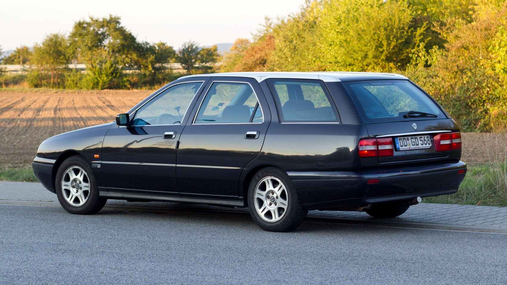 Sleek station wagon rear with large windows and alloy wheels