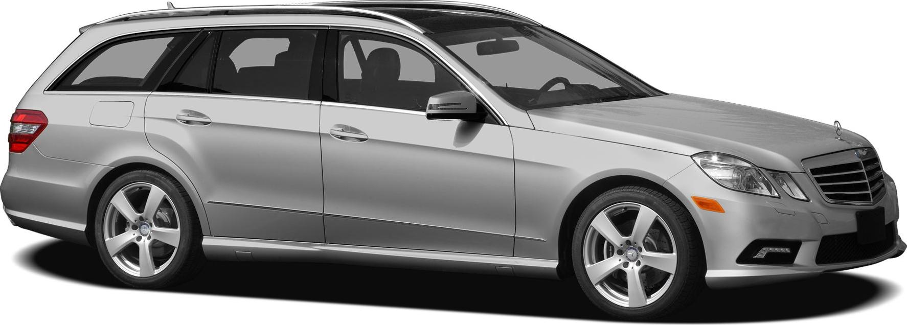 Silver luxury station wagon with five-spoke alloy wheels and roof rails