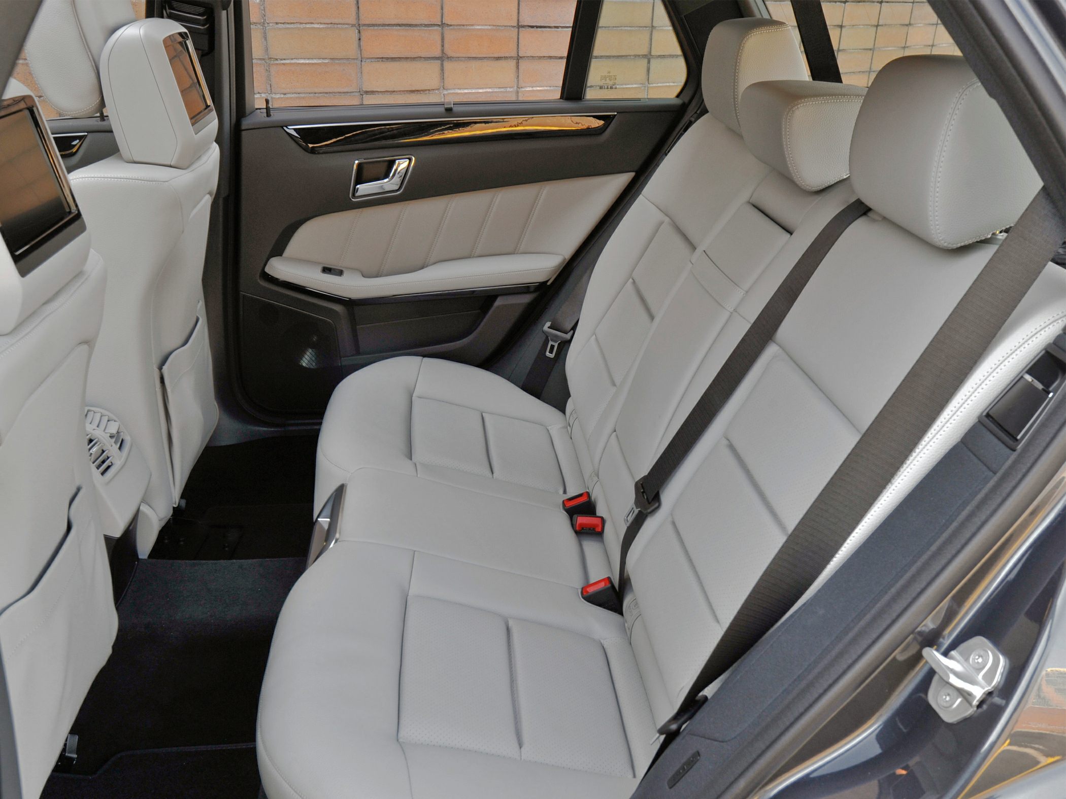 Rear leather seats with headrest entertainment screens